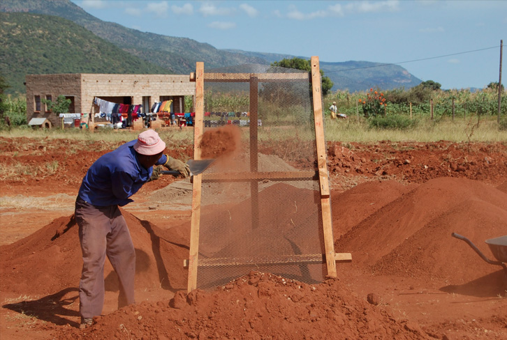 Hand Screening Earth Block Soil